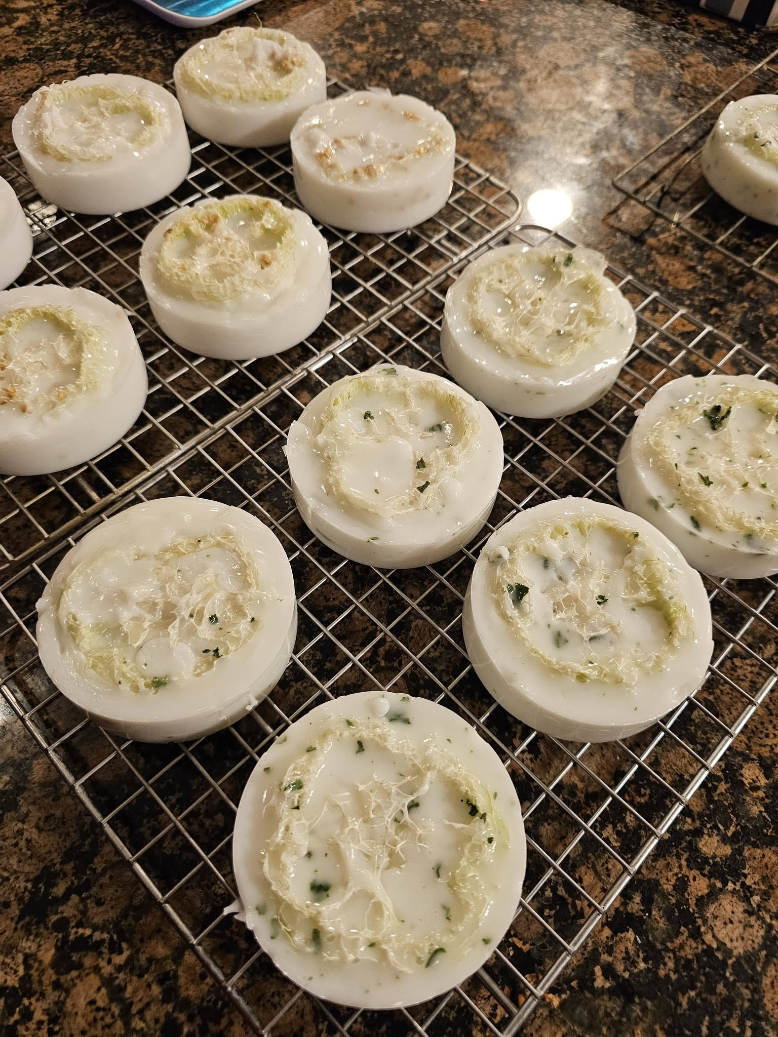 Freshly made loofah soaps cooling on a wire rack