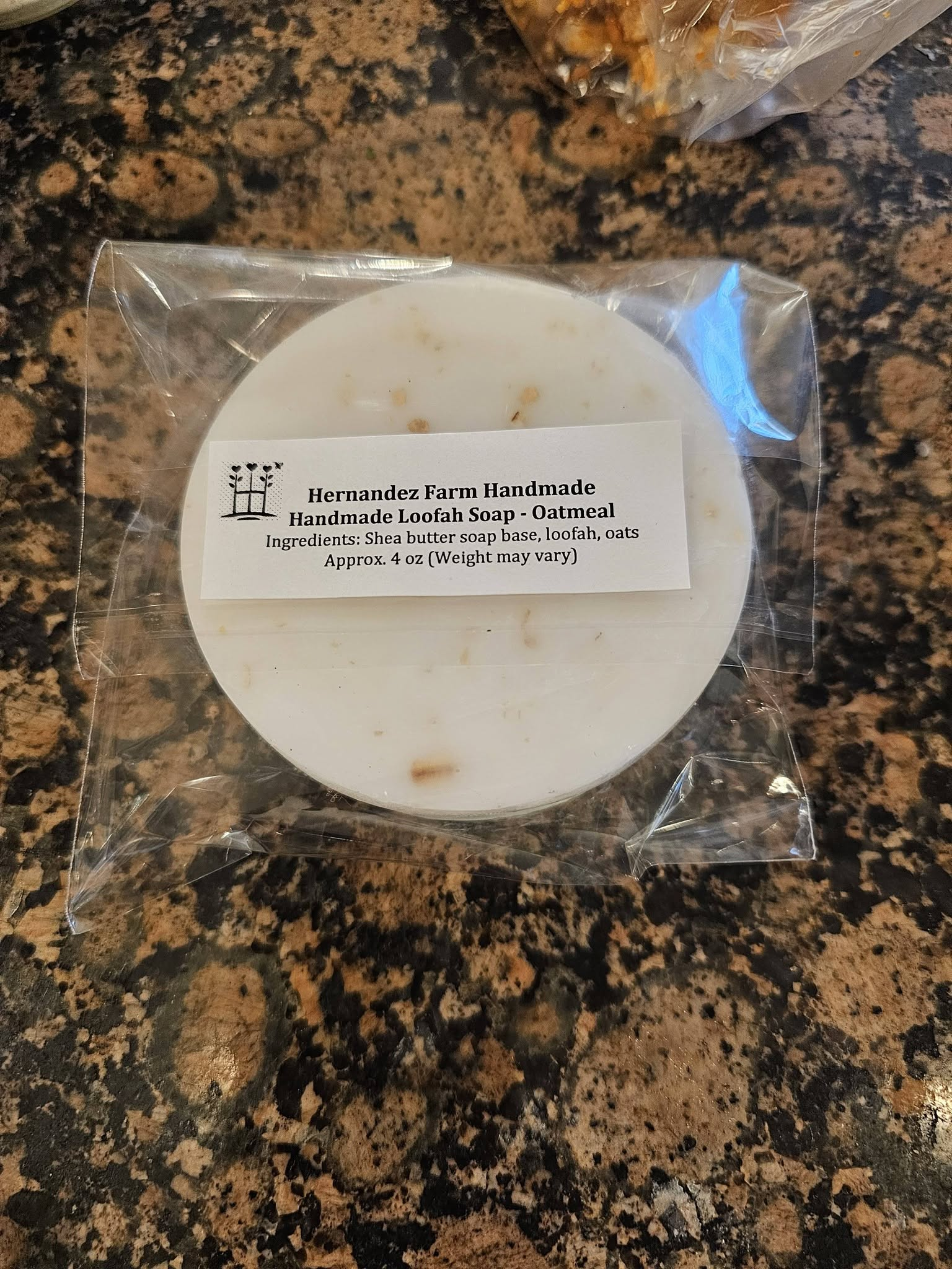 Packaged oatmeal loofah soap showing the back label